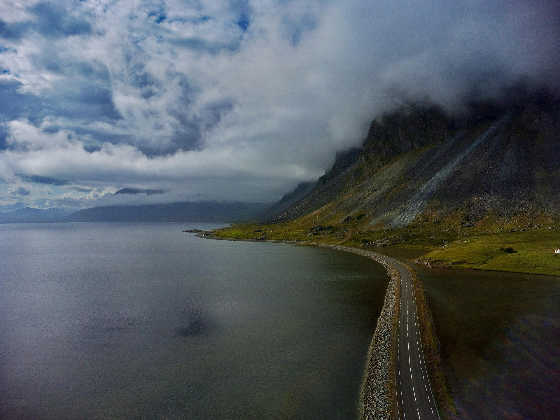 Vestrahorn mountain rising over a coastal road at Stokksnes, Iceland